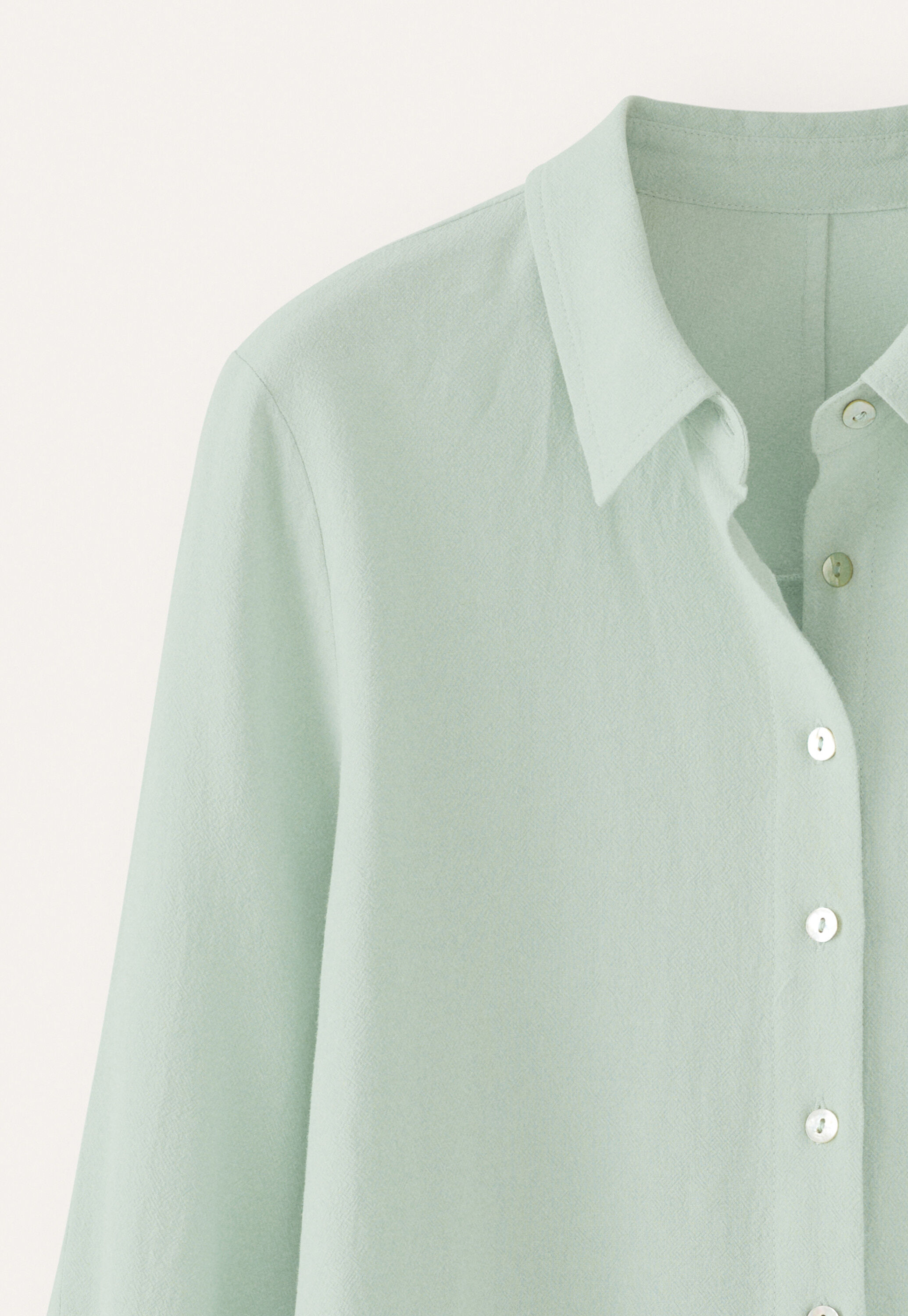 Curved-sleeve blouse